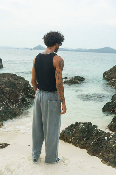 Grey faded loose fit pants from Bonkers Corner with relaxed style and casual fit, shown on a model.