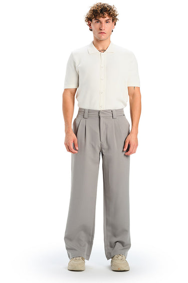 Grey loose fit tailored trousers by Bonkers Corner, showing front view with waistband and relaxed fit fabric.