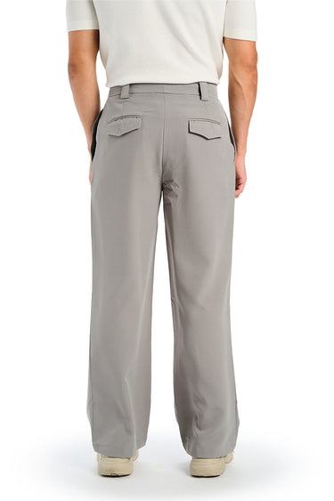 Grey loose fit tailored trousers by Bonkers Corner, shown laid flat with a relaxed, modern design and tailored fit.