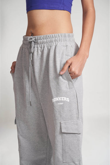 Grey melange cargo pants from Bonkers Corner featuring multiple pockets and a relaxed fit, displayed on a plain background.