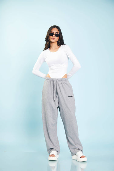 Grey melange loose fit joggers from Bonkers Corner, showing a relaxed style with elastic waistband and cuffed ankles.