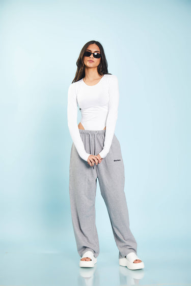 Grey melange loose fit joggers from Bonkers Corner, featuring a relaxed style and comfortable fit, shown on a model.