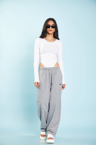 Grey melange loose fit joggers from Bonkers Corner with an elastic waistband and relaxed style, shown on a model.