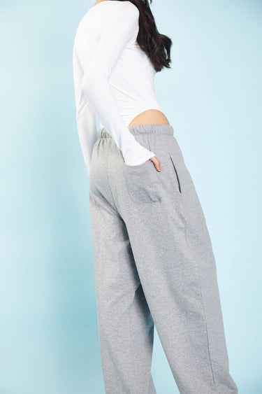 Grey melange loose fit joggers from Bonkers Corner, showing the relaxed fit and soft fabric texture.
