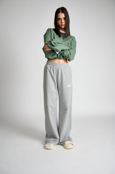 Grey melange wide-leg pants by Bonkers Corner, featuring a relaxed fit and comfortable fabric, styled on a model.