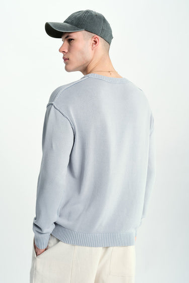 Grey Bonkers Corner Mode Crewneck Sweatshirt displayed on a hanger, showcasing its relaxed fit and soft fabric.