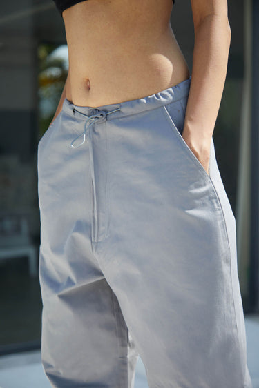 Grey parachute pants by Bonkers Corner featuring a relaxed fit, adjustable waistband, and lightweight, breathable fabric.