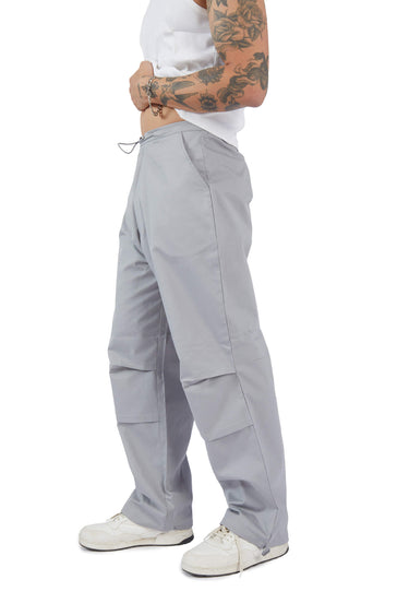 Grey parachute pants by Bonkers Corner featuring a relaxed fit and adjustable drawstring waist.