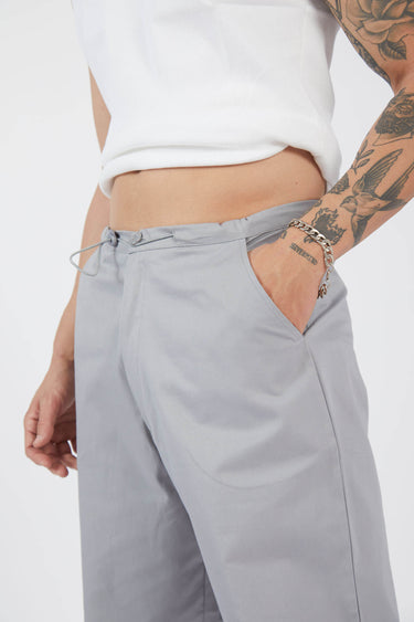 Gray parachute pants by Bonkers Corner featuring a relaxed fit and adjustable waistband, displayed on a neutral background.