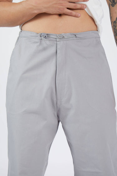 Grey parachute pants by Bonkers Corner featuring a relaxed fit, adjustable drawstring waist, and cuffed ankles.