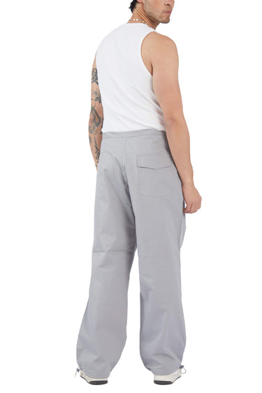Grey parachute pants from Bonkers Corner with a relaxed fit and drawstring waist, made from lightweight, durable fabric.