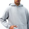 Grey Wear A Hug oversized hoodie by Bonkers Corner, featuring a cozy fit and soft fabric, shown on a model.
