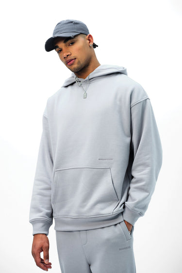 Grey Wear A Hug oversized hoodie by Bonkers Corner, featuring a relaxed fit and soft fabric, shown on a model.