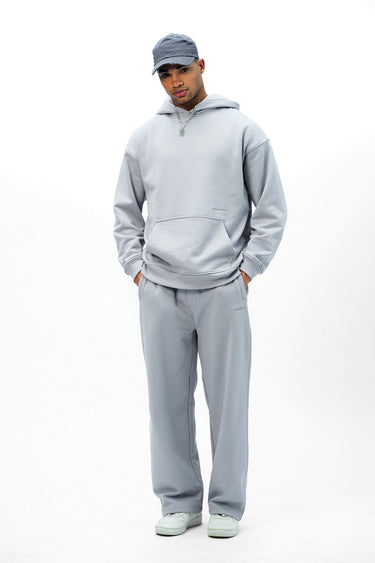 Grey Wear A Hug oversized hoodie by Bonkers Corner, featuring a relaxed fit and soft fabric, shown on a model.