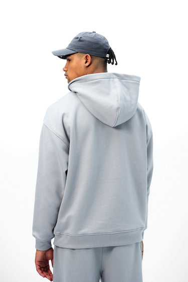 Grey Wear A Hug oversized hoodie by Bonkers Corner featuring a relaxed fit and comfortable design, shown in the image.