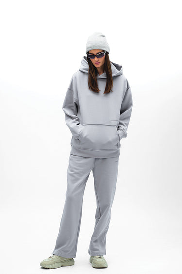 Grey Wear A Hug oversized hoodie by Bonkers Corner, featuring a cozy fit and casual style, displayed on a hanger.