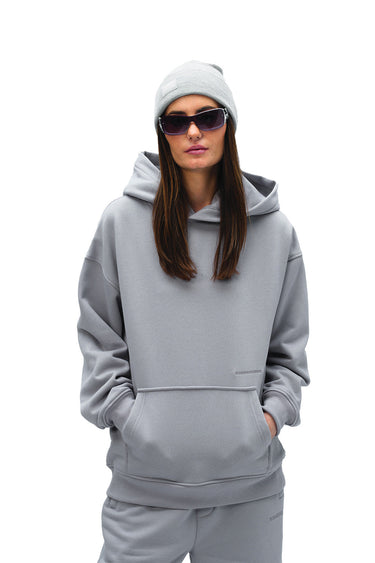 Grey Wear A Hug oversized hoodie by Bonkers Corner, featuring a relaxed fit and soft fabric, displayed on a hanger.