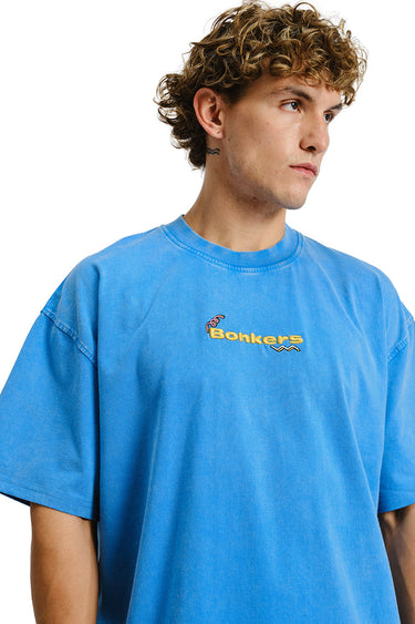 Bonkers Corner Homeboys faded blue oversized T-shirt displayed on a hanger, casual streetwear style with relaxed fit.