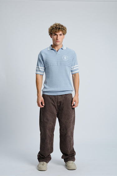 Light blue Icy Spicy Knit Polo shirt by Bonkers Corner, close-up of textured fabric and classic collar detail.