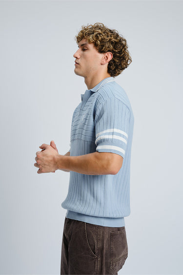 Bonkers Corner Icy Spicy Knit Polo shirt in light blue with a collared neckline and textured knit fabric.