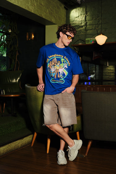 Blue oversized T-shirt by Bonkers Corner featuring colorful imaginary friends graphic on the front.
