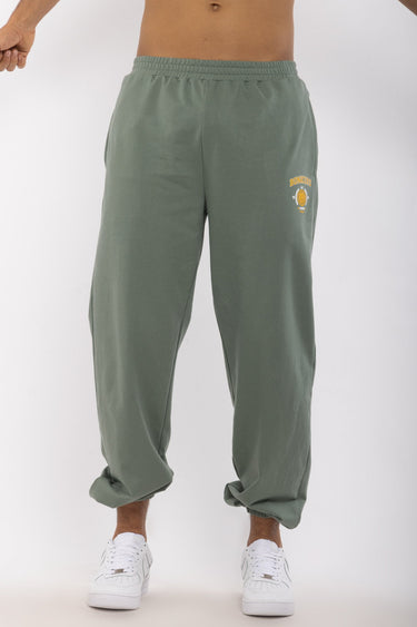 Bonkers Corner Jade Joggers in size XS, featuring a relaxed fit with green fabric and elastic waistband for comfortable casual wear.