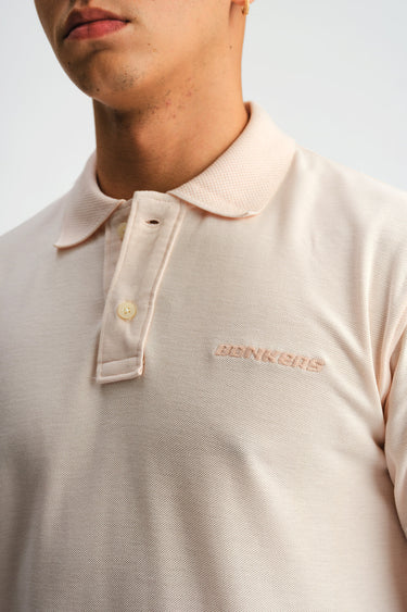 Light pink Bonkers Corner Signature Jacquard Collar Premium Polo shirt with detailed collar and textured fabric.