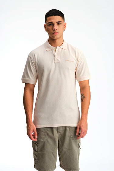 Light pink Bonkers Corner Signature Jacquard Collar Premium Polo shirt with detailed collar design and soft fabric.