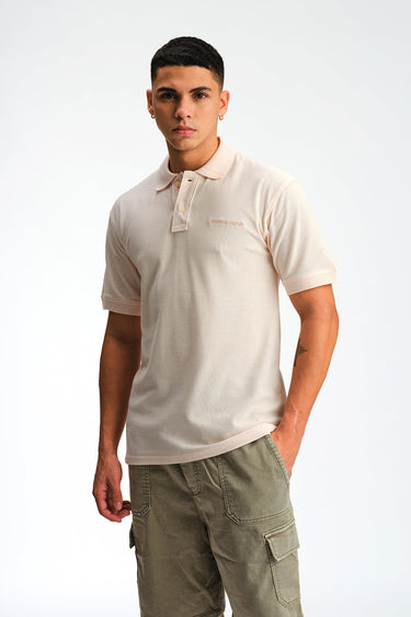 Light pink Bonkers Corner Signature Jacquard Collar Premium Polo shirt with detailed collar design and subtle branding.