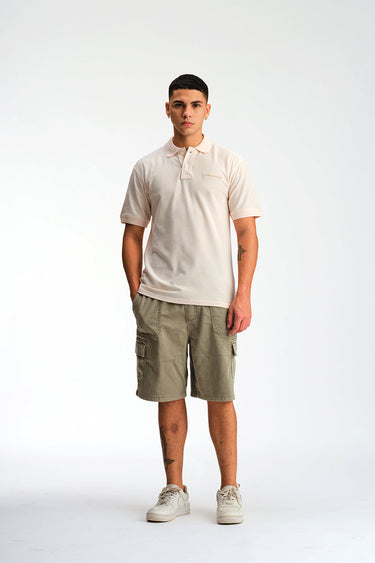 Light pink Bonkers Corner signature jacquard collar premium polo shirt displayed on a mannequin.