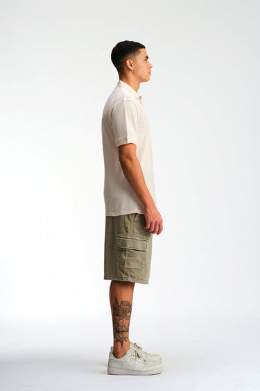 Light pink Bonkers Corner Signature Jacquard Collar Premium Polo shirt with a detailed jacquard pattern and classic collar design.