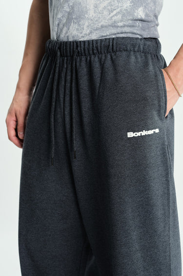 Bonkers Corner Midnight Miles loose fit joggers in dark fabric, shown laid flat with elastic waistband and relaxed fit.