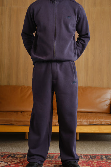 Navy blue Bonkers Corner On The Go joggers with elastic waistband and relaxed fit, shown on a model.