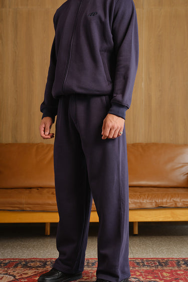 Navy blue On The Go joggers by Bonkers Corner, featuring a comfortable fit and casual style, shown on a model.