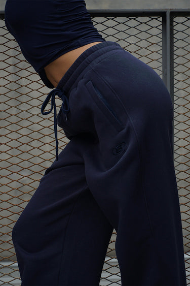 Navy blue Bonkers Corner On The Go joggers featuring a relaxed fit and elastic waistband, perfect for casual wear.