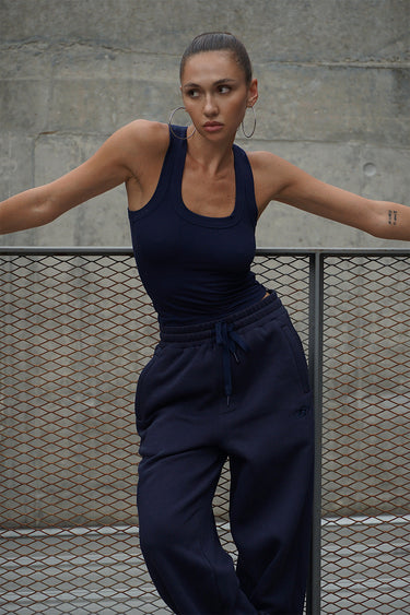 Navy blue On The Go joggers by Bonkers Corner, featuring a comfortable fit and casual style, shown on a model.