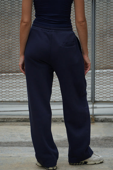 Navy blue Bonkers Corner On The Go joggers with elastic waistband and cuffed ankles, made of comfortable fabric.