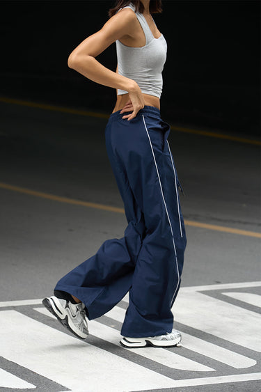 Navy blue sporty deconstructed loose pants by Bonkers Corner, relaxed fit with casual style and comfortable fabric.