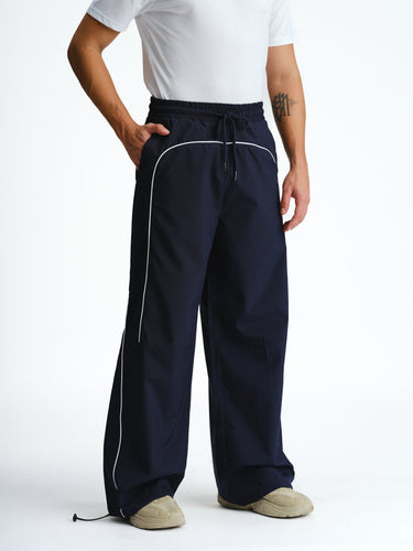 Navy blue sporty deconstructed loose pants by Bonkers Corner, relaxed fit with a casual, athletic style.
