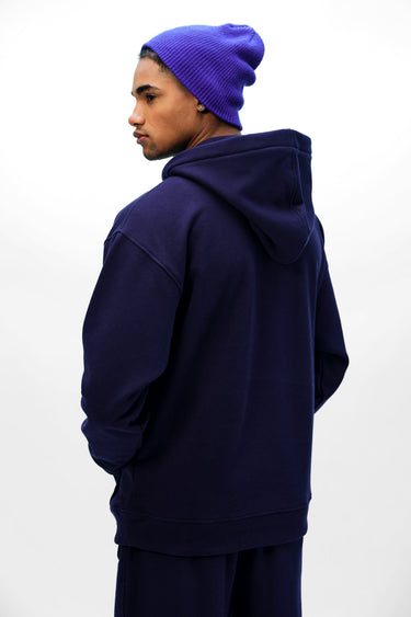 Navy blue Wear A Hug oversized hoodie by Bonkers Corner, featuring a relaxed fit and soft fabric for comfortable casual wear.