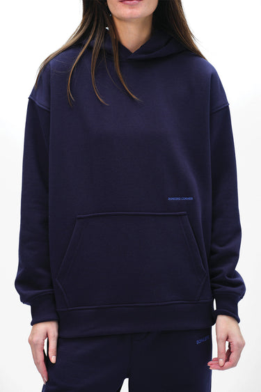 Navy blue Wear A Hug oversized hoodie by Bonkers Corner, featuring a relaxed fit and soft fabric, shown on a hanger.