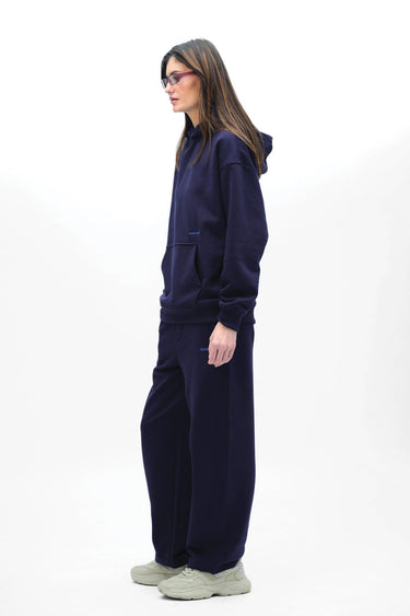 Navy blue Wear A Hug oversized hoodie by Bonkers Corner, featuring a relaxed fit and soft fabric, displayed on a hanger.