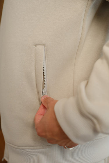 Bonkers Corner Oatmilk High Neck Zipper Jacket in XS with a high collar, front zipper, and stylish design.