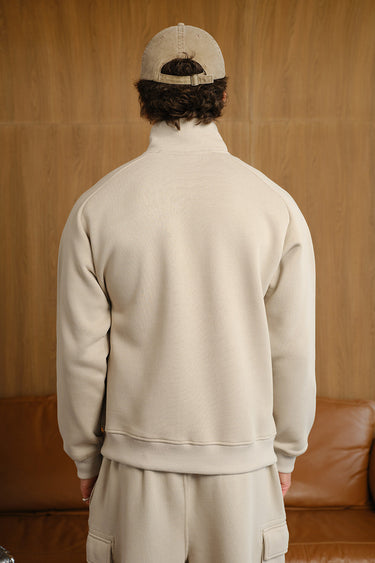 Bonkers Corner Oatmilk High Neck Zipper Jacket on model, showcasing its high neckline and casual fit.