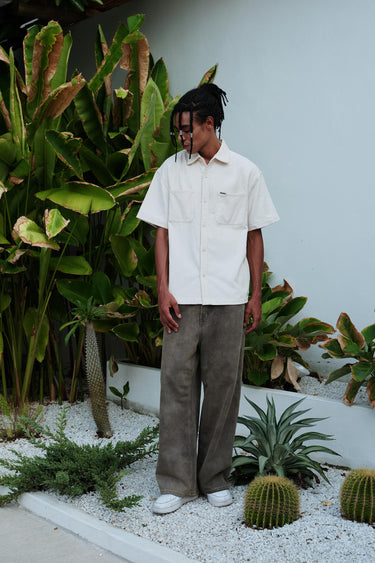 Off White corduroy shirt from Bonkers Corner, featuring a classic collar, button front, and textured fabric.