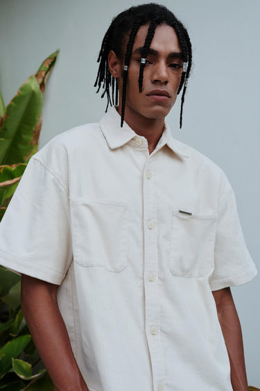 Bonkers Corner Off White Corduroy Shirt displayed flat, featuring a classic collar and textured fabric, casual style for everyday wear.