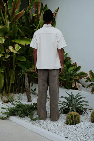 Off White corduroy shirt by Bonkers Corner featuring a classic collar and button-front design, shown in a close-up image.
