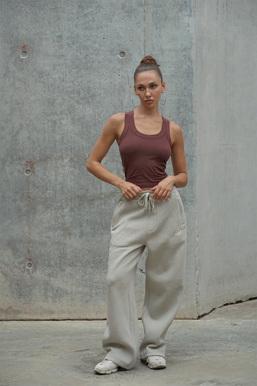 Bonkers Corner Off White On The Go Joggers displayed on a model, featuring a comfortable fit and casual style.