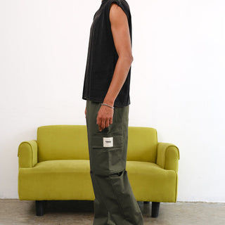 Olive cargo pants with utility pockets from Bonkers Corner, featuring a relaxed fit and functional design.