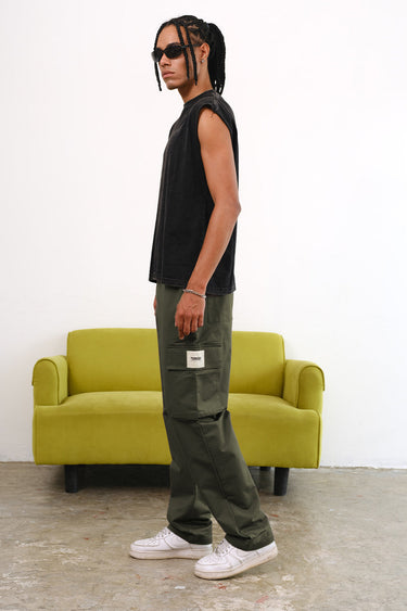 Olive cargo pants with utility pockets from Bonkers Corner, featuring a relaxed fit and functional design.